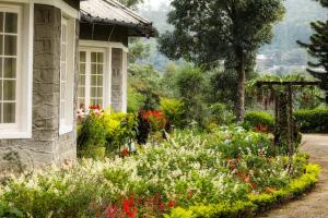 Vonkajšia záhrada v ubytovaní Lockhart Bungalow Munnar - a CGH Earth SAHA Experience