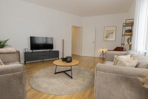 A television and/or entertainment centre at LaMiaCasa City Groupes & Familles 140qm