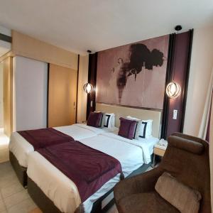 BEYZAA HOTEL AND SUITES में एक कमरे में एक या कई बेड