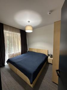 Apartment Kokhta-Mitarbi B3 408 객실 침대