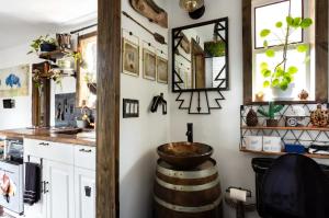 a kitchen with a large barrel sink and a counter at Cozy AF Tiny-House Oasis in Tampa