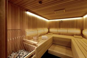 a wooden sauna with a hammock in it at Hilton Vienna Plaza in Vienna