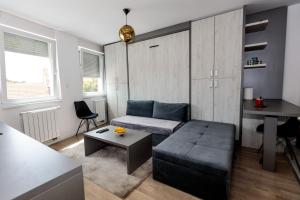 Гостиная зона в Apartman Skver