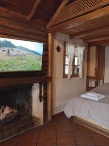 Una cama o camas en una habitación de Cabaña los Aromos