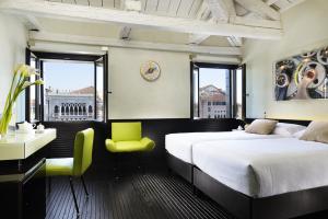 En eller flere senge i et værelse på Hotel L'Orologio Venezia - WTB Hotels