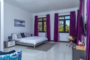 Voodi või voodid majutusasutuse Upendo Boutique Hotel, Dar es Salaam toas