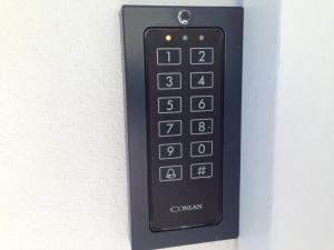 a black remote control attached to a wall at Helts B&B - Helts Guesthouse in Herning