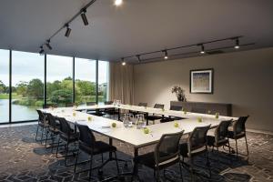 a large conference room with a long table and chairs at Punthill Caroline Springs in Caroline Springs