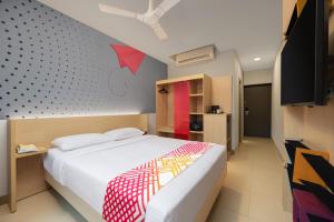 Tempat tidur dalam kamar di Ginger Vadodara