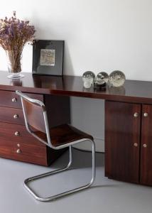 a wooden desk with a chair in front of it at Casa Briteiros in Guimarães