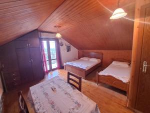 A bed or beds in a room at Guest House Argjiro Castle