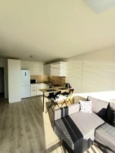 A kitchen or kitchenette at New apartment 5 minutes by walk from the airport with free garage parking