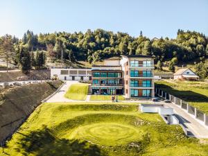 an aerial view of a building with a green yard at Villa Galleria in Colibiţa