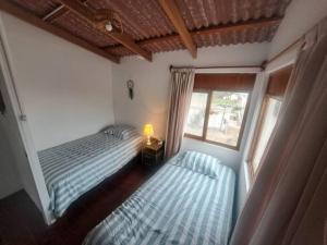 Cama ou camas em um quarto em Linda casa de campo en Mejia - Arequipa