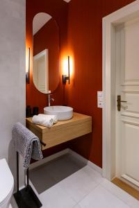 a bathroom with a sink and a mirror at Luxurious Minimalist Residence with Sauna by Prestige Homes in Budapest