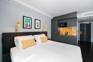 A bed or beds in a room at Staycity Aparthotels Heidelberg