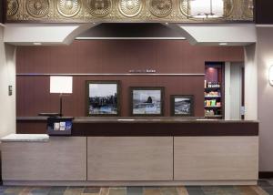 a reception counter in a hotel lobby with at Hampton Inn & Suites Boise-Downtown in Boise