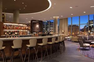 a bar in a hotel with a view of the city at Conrad Washington DC in Washington