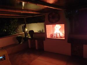 a fireplace in a room with a fire in it at Best Area Close to Leeds Centre in Leeds