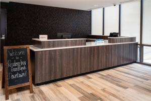 a lobby with a reception counter and a sign at Residence Inn by Marriott Grand Rapids Downtown in Grand Rapids