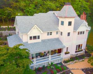 an aerial view of a large white house at Inn at Rose Hall in Eureka Springs