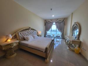 Katil atau katil-katil dalam bilik di Beachfront Holiday Homes