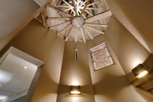 a large chandelier hangs from the ceiling of a room at Hotel Nassau Breda, Autograph Collection in Breda