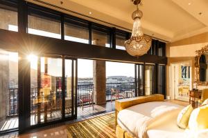 A bed or beds in a room at The Silo Hotel