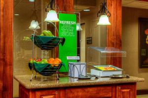 a counter with a bowl of fruit on it at Hampton Inn & Suites Mountain Home in Mountain Home