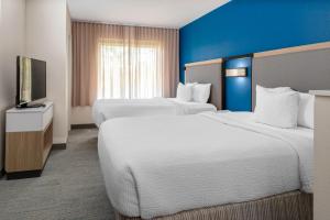 Кровать или кровати в номере SpringHill Suites by Marriott Baton Rouge South