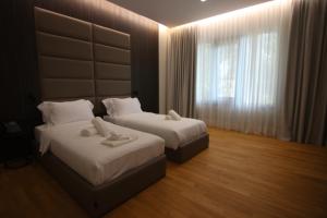 Boutique Hotel Adelar房間的床