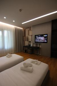 Boutique Hotel Adelar房間的床