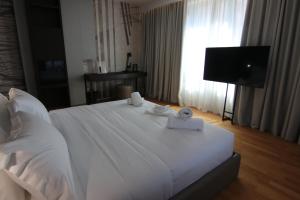 Boutique Hotel Adelar房間的床