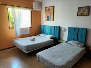 Postel nebo postele na pokoji v ubytování Lagarto Hostel Tenerife