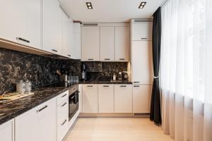 Кухня или кухненски бокс в LuxeCityApartment