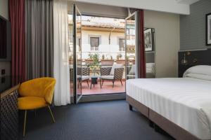 Cama ou camas em um quarto em iQ Hotel Firenze