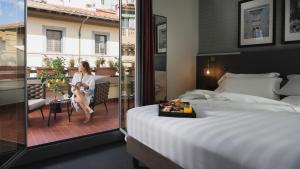 Cama ou camas em um quarto em iQ Hotel Firenze