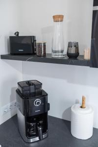 a coffee maker is sitting on a counter at TEILOR Apartments 5 in Floreşti