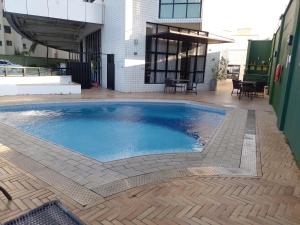 a swimming pool in the middle of a building at Natal Plaza Suítes- Ponta Negra in Natal