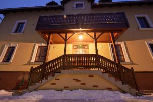 a large house with a large wooden stair case at Villa Ganzstein in Mürzzuschlag