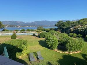 an aerial view of a garden with benches and bushes at Villa 8 au Village Marin in Porto-Vecchio