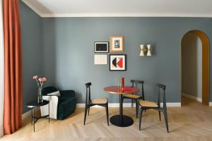 a living room with a table and chairs at Casa Brivio in Milan