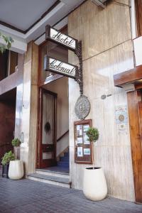 a building with a sign on the side of it at Hotel Colonial Salta in Salta