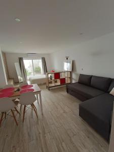 a living room with a couch and a table at Tomarhousing - 37 Old Town in Tomar