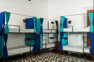 A bed or beds in a room at Hostal Azul