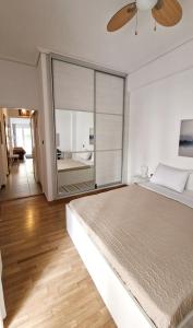 A bed or beds in a room at Apartment in the heart of Athens