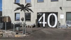 a building with the number in front of it at Business-Motel, free XL-Parking, WiFi, massage-chairs, sauna, shared kitchen, breakfast 2go, free soda, coffee in Heimsheim