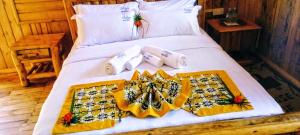 Cama ou camas em um quarto em Keije Resort Bunyonyi