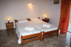 A bed or beds in a room at Olympion Village Studios