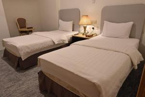 Tempat tidur dalam kamar di Al Furat Madayin Hotel